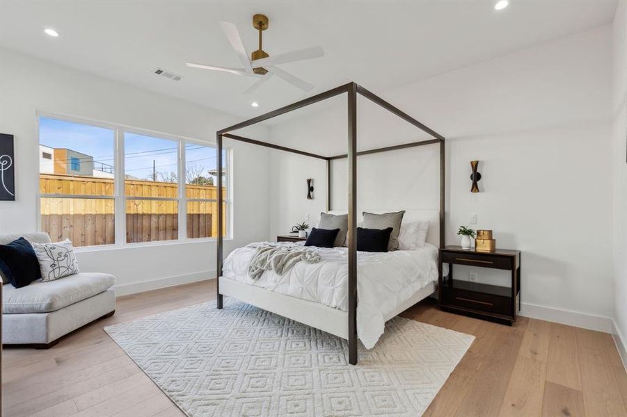 Bedroom featuring ceiling fan and light wood-type flooring