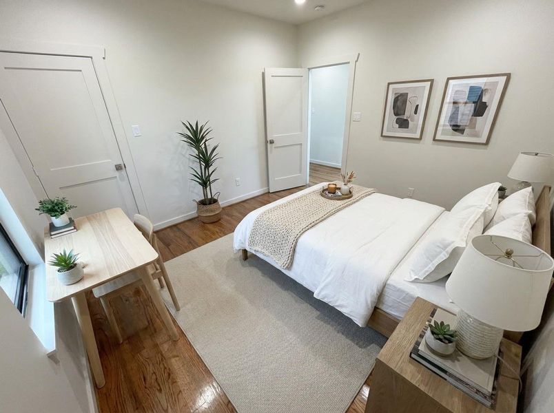 Bright and inviting, this well-appointed secondary bedroom features real hardwood floors, abundant natural light, and flexible space that's perfect for family, guests, or a comfortable home office.