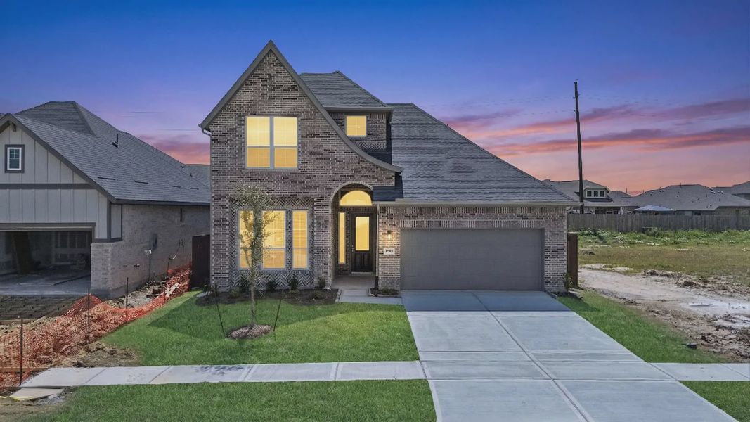 Representative exterior photo of a completed home built from the Cayman by Chesmar Homes in Blue Heron, Mont Belvieu, TX (Image 2). Representative exterior photo of a completed home built from the Cayman by Chesmar Homes in Blue Heron, Mont Belvieu, TX (Image 2).