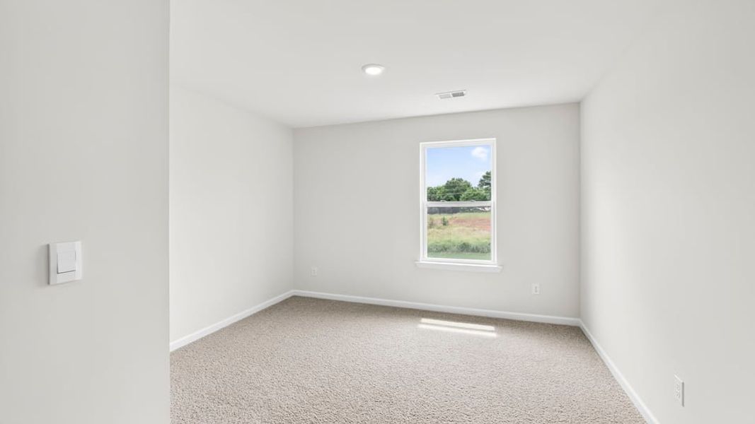 Spacious, unfurnished interior of a new home in Durbin Meadows Traditions, Fountain Inn (Image 27).