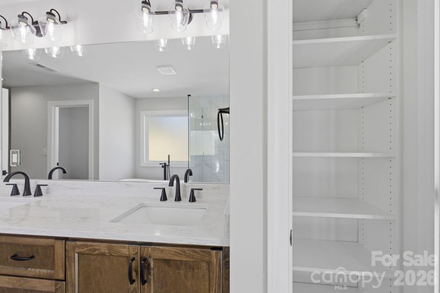 1 out the 2 linen closets in Primary bath