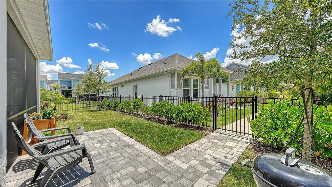 Exterior details and patio area of a home in Emerald Landing at Waterside at Lakewood Ranch – Lake Series, Sarasota (Image 32).
