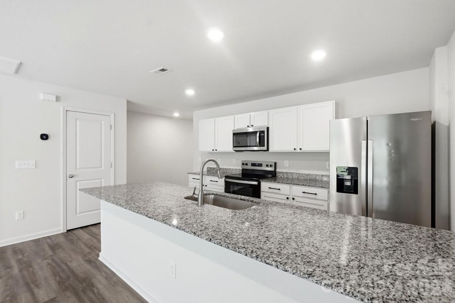 Furnished interior view inside a new home in Trivium, Newton (Image 9).