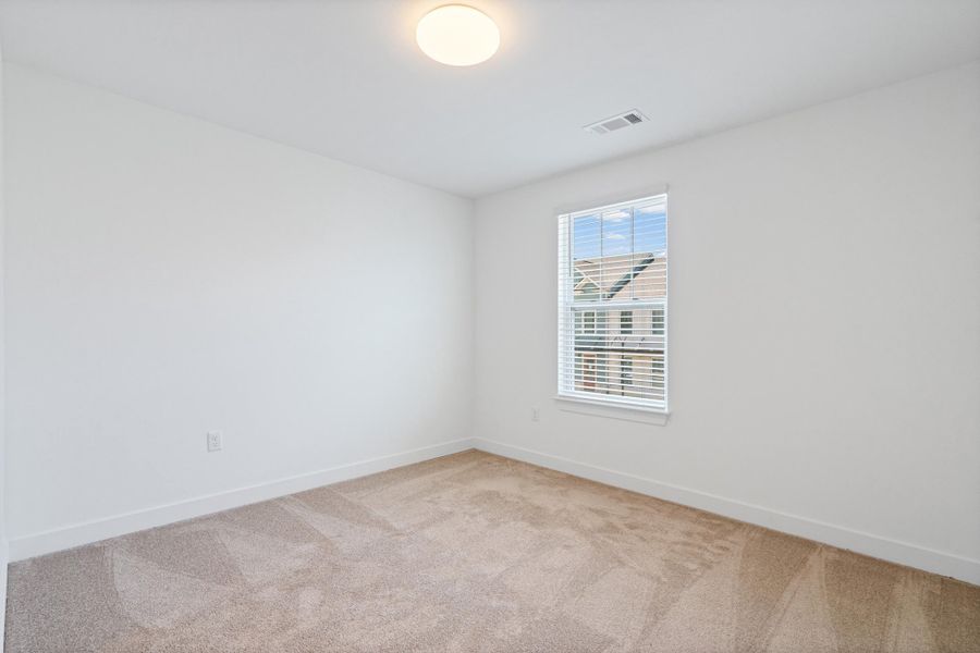 Neutral-toned carpeting complements the white walls and trim Neutral-toned carpeting complements the white walls and trim