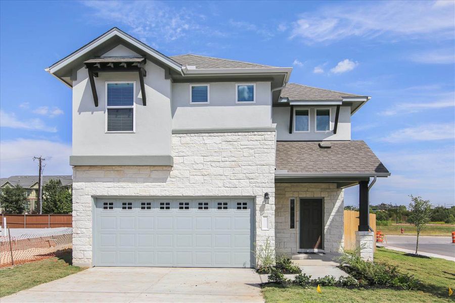 Front exterior of a new home in Crosswinds, Kyle, TX, highlighting curb appeal (Image 4). Front exterior of a new home in Crosswinds, Kyle, TX, highlighting curb appeal (Image 4).