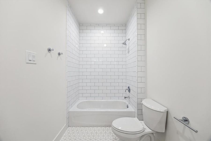 Jack & Jill bath tub/combo and creative cube tile floor.