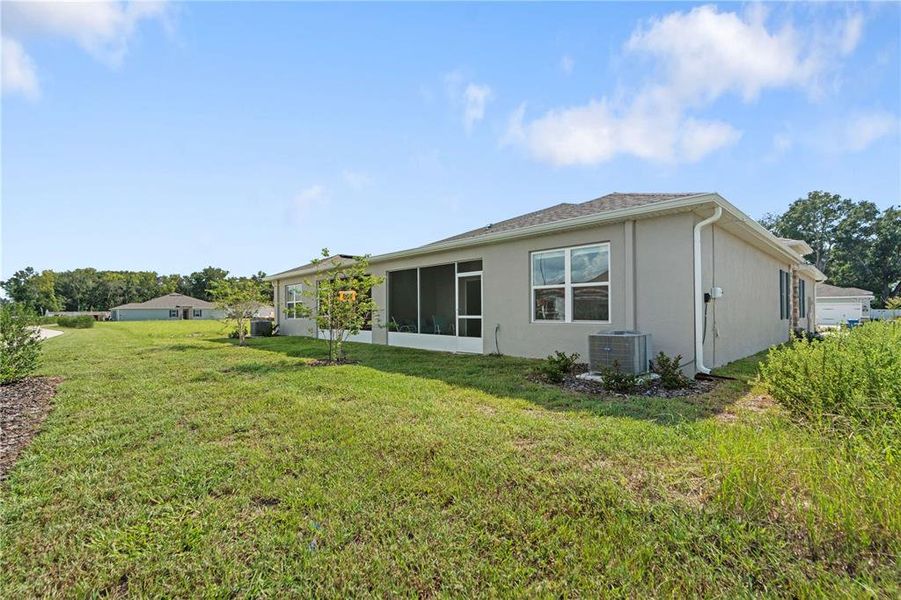 Front exterior of a new home in Park Ridge Villas, Spring Hill, FL, highlighting curb appeal (Image 22).