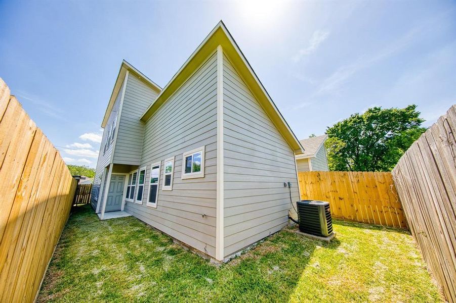 This nearly complete view of your backyard showcases a fully fenced space, providing both security and privacy. It's perfect for your furry friends to roam freely without worry, while ensuring that you can enjoy your outdoor oasis without prying eyes. If privacy is a priority for you, this fence will certainly meet your needs.