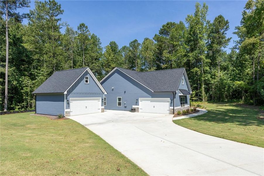 Front exterior of a new home in , Dallas, GA, highlighting curb appeal (Image 23).