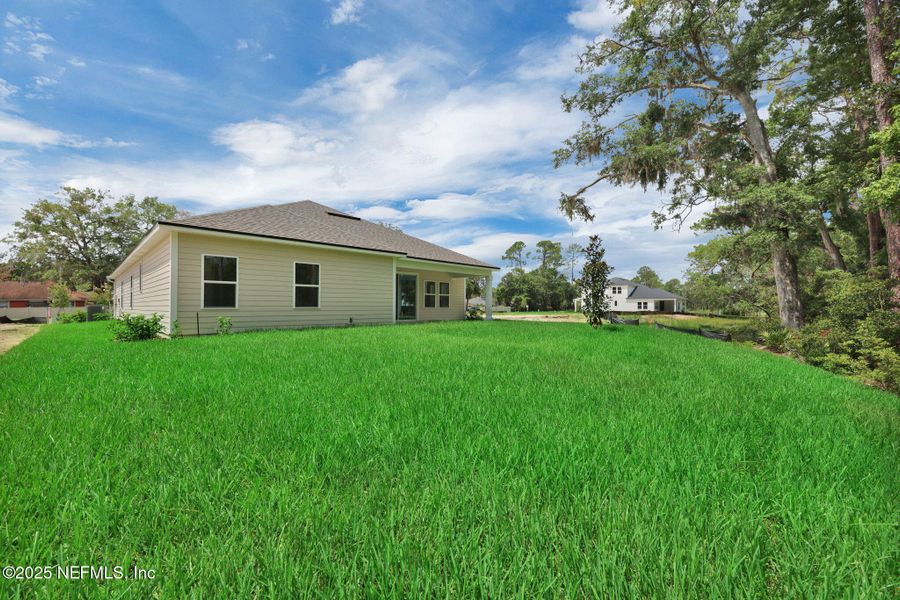 Exterior details and patio area of a home in Creighton Pointe, Fleming Island (Image 27). Exterior details and patio area of a home in Creighton Pointe, Fleming Island (Image 27).