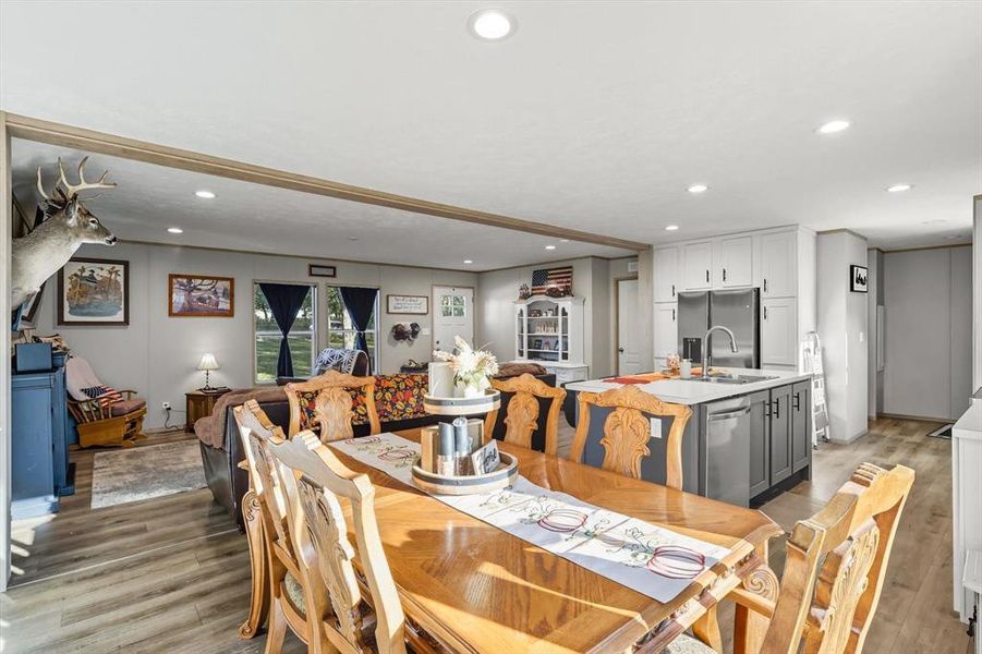 Dining area featuring light wood-style floors and recessed lighting Dining area featuring light wood-style floors and recessed lighting