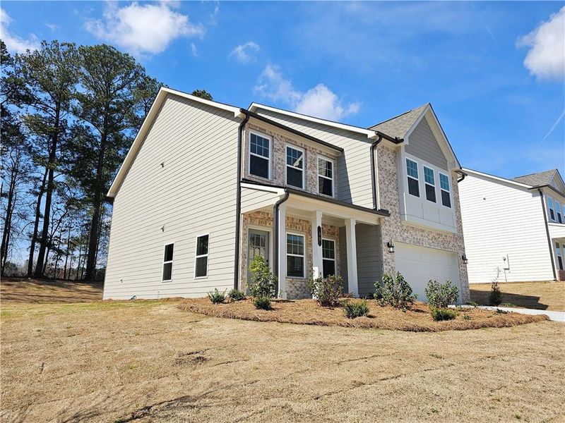 Front exterior of a new home in The Estates at Casteel, Bethlehem, GA, highlighting curb appeal (Image 21).