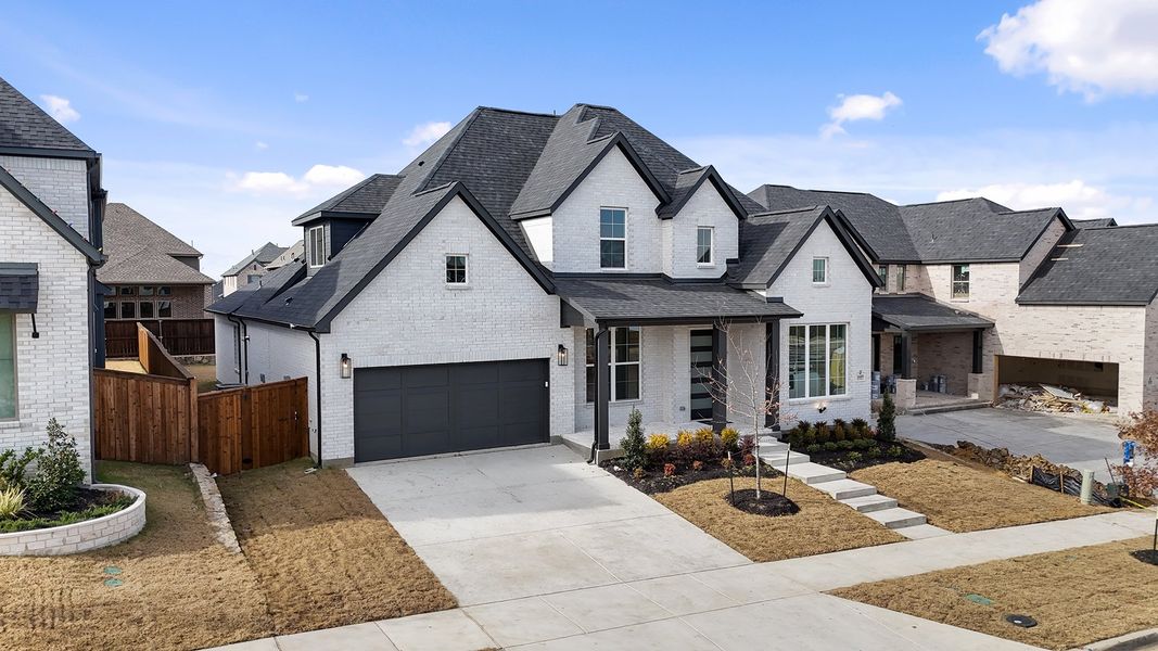 Front exterior of a new home in Estates at Rockhill, Frisco, TX, highlighting curb appeal (Image 2). Front exterior of a new home in Estates at Rockhill, Frisco, TX, highlighting curb appeal (Image 2).