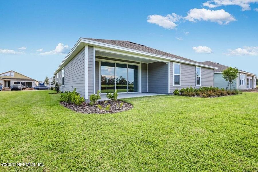 Exterior details and patio area of a home in Colbert Landings, Palm Coast (Image 2).