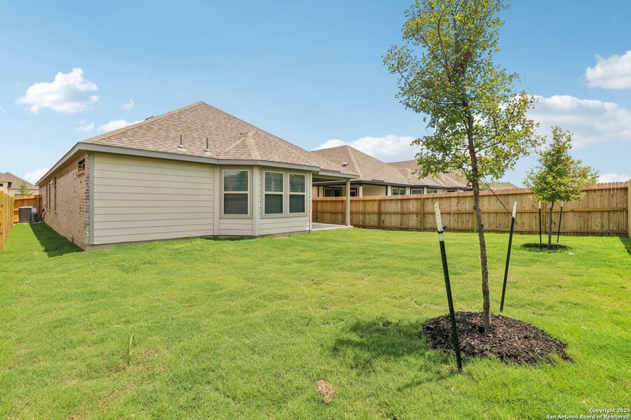 Front exterior of a new home in Kallison Ranch, San Antonio, TX, highlighting curb appeal (Image 26). Front exterior of a new home in Kallison Ranch, San Antonio, TX, highlighting curb appeal (Image 26).