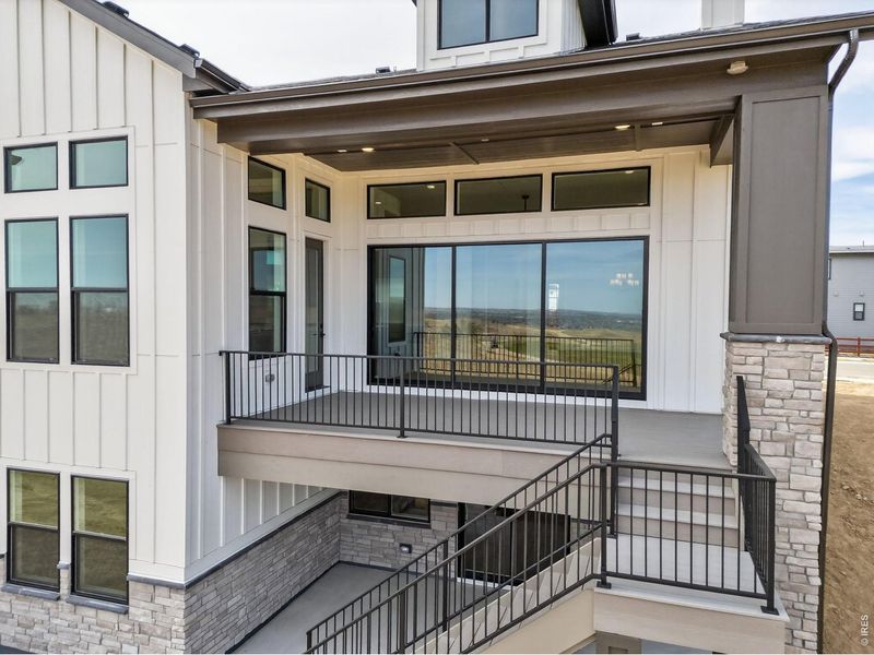 Exterior details and patio area of a home in RainDance, Windsor (Image 3).