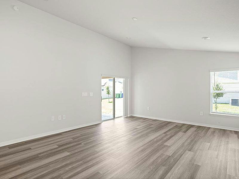 Enjoy an open living area with airy volume ceilings and low-maintenance LVP flooring.