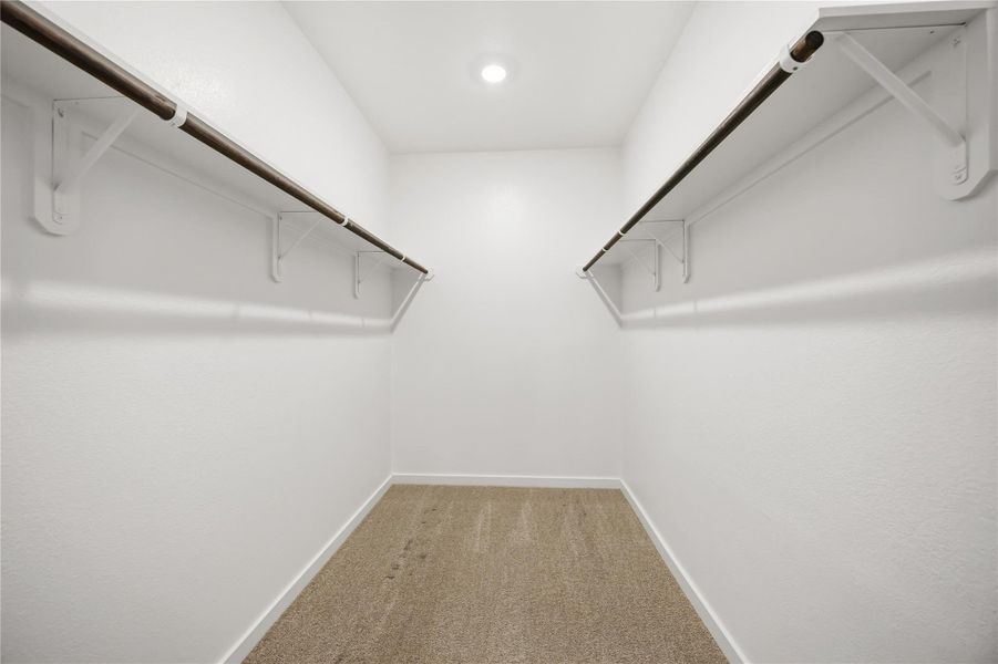 Spacious primary bedroom closet Spacious primary bedroom closet