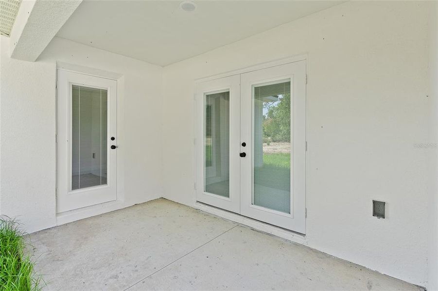 French doors to dining and to 2nd Primary Bedroom