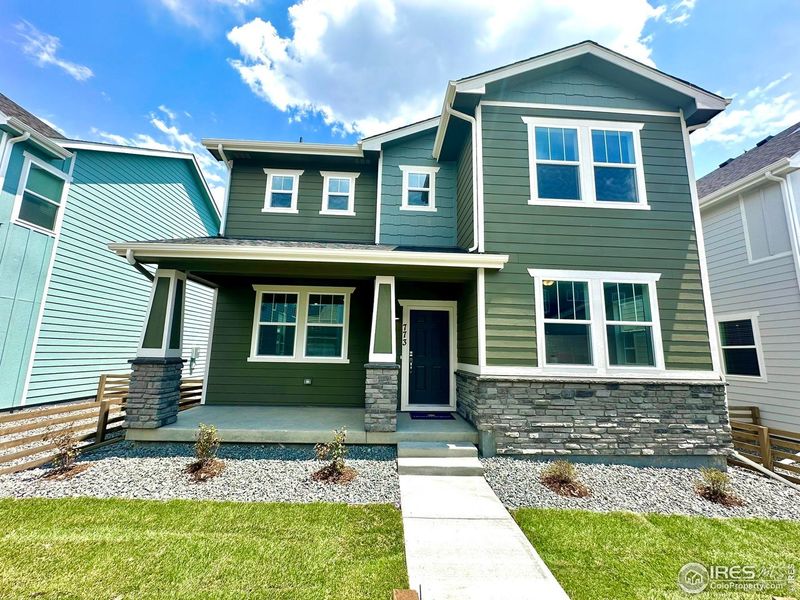 Front exterior of a new home in Waterfield, Fort Collins, CO, highlighting curb appeal (Image 2). Front exterior of a new home in Waterfield, Fort Collins, CO, highlighting curb appeal (Image 2).