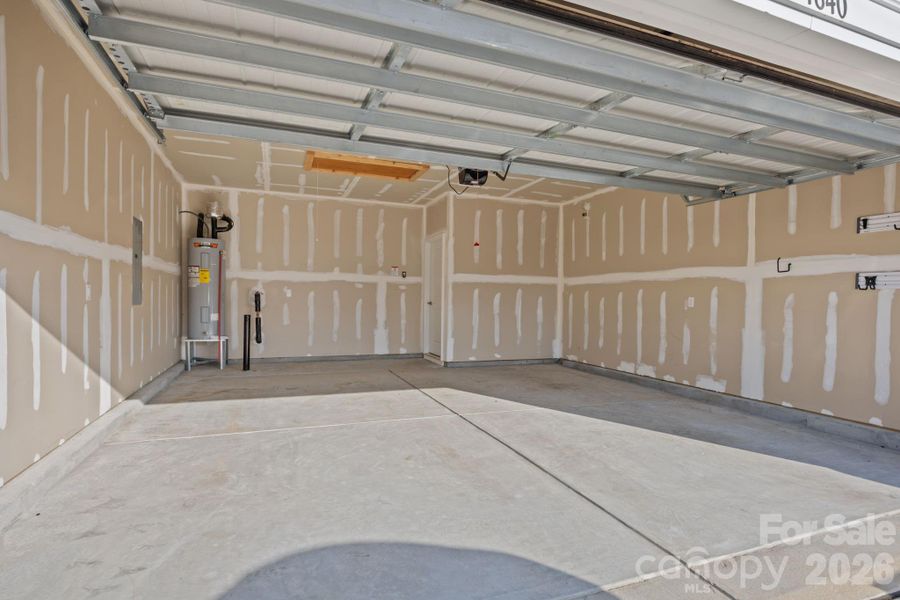 Extra large garage, insulated and drywalled!  PLUS BONUS storage room with pull down stairs!