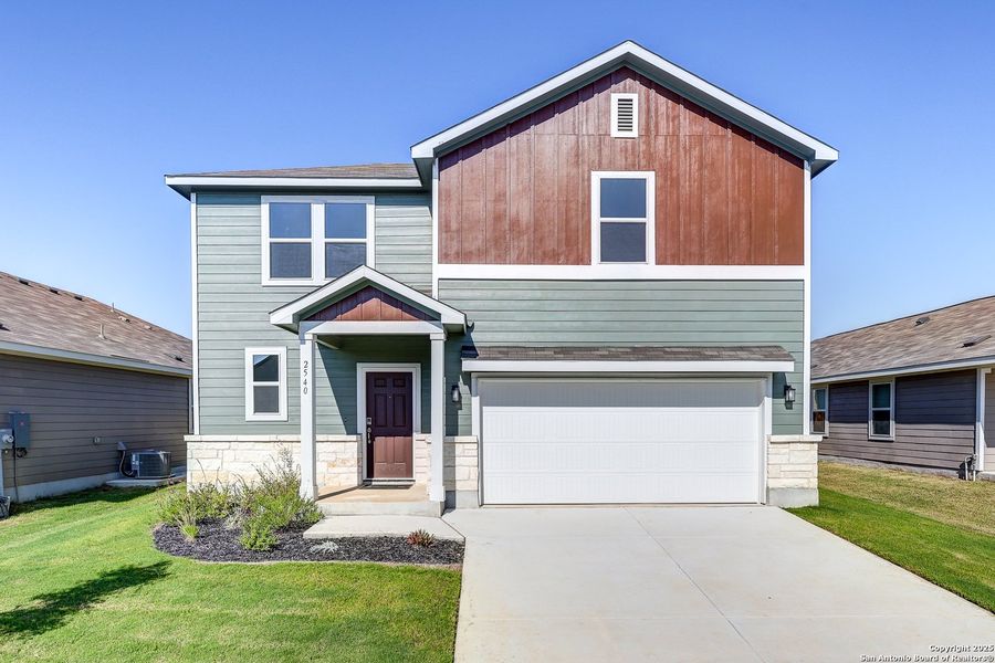 Front exterior of a new home in Hiddenbrooke, Seguin, TX, highlighting curb appeal (Image 22). Front exterior of a new home in Hiddenbrooke, Seguin, TX, highlighting curb appeal (Image 22).