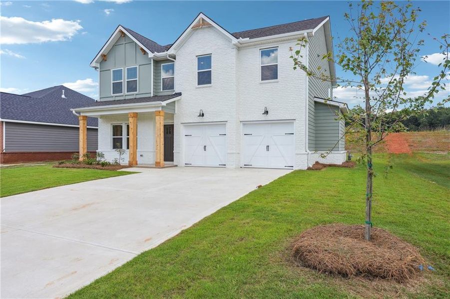 Front exterior of a new home in Conner Springs, Social Circle, GA, highlighting curb appeal (Image 19). Front exterior of a new home in Conner Springs, Social Circle, GA, highlighting curb appeal (Image 19).