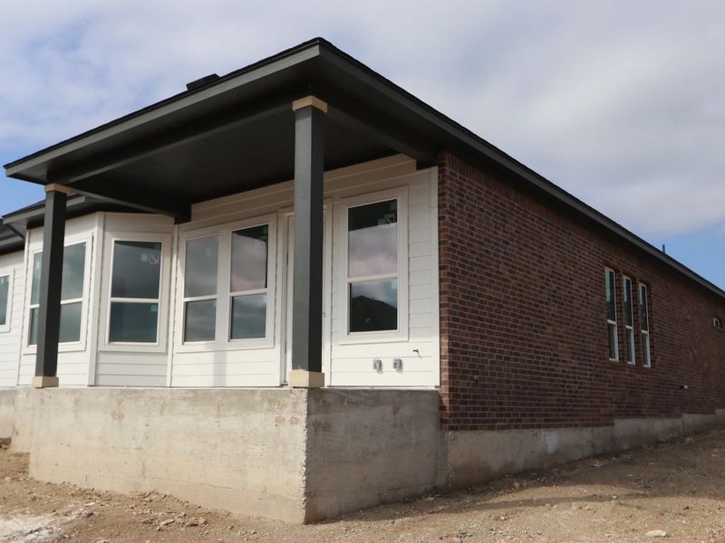 Exterior details and patio area of a home in Heritage, Dripping Springs (Image 2). Exterior details and patio area of a home in Heritage, Dripping Springs (Image 2).