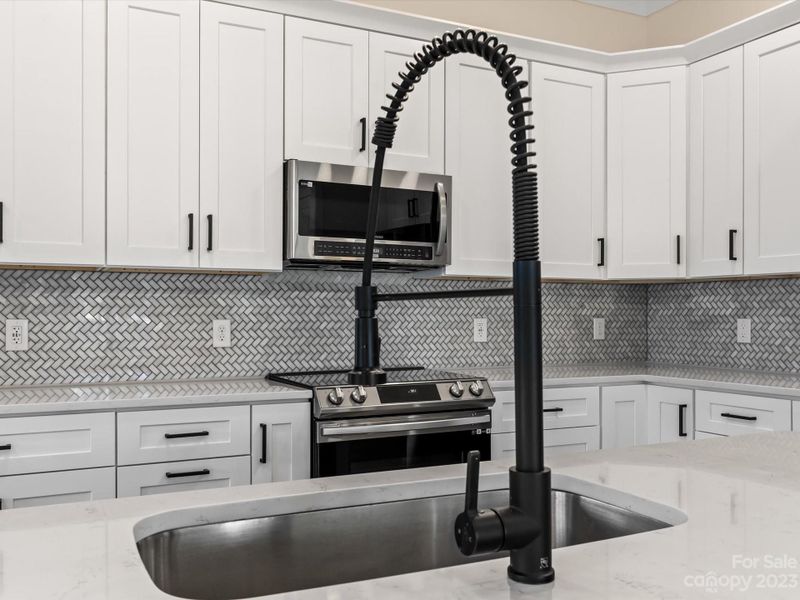 Gourmet Kitchen w/Herringbone Tile Backsplash