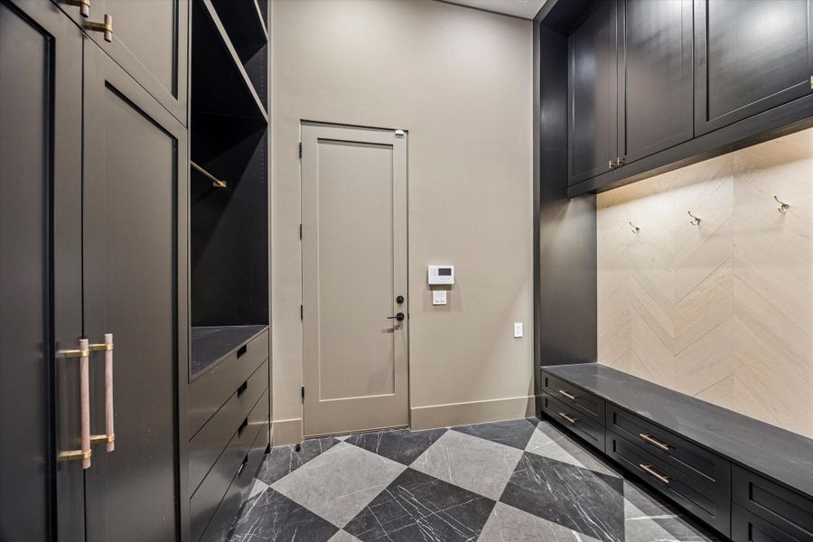 Mud room as you enter house from garage with plenty of storage.