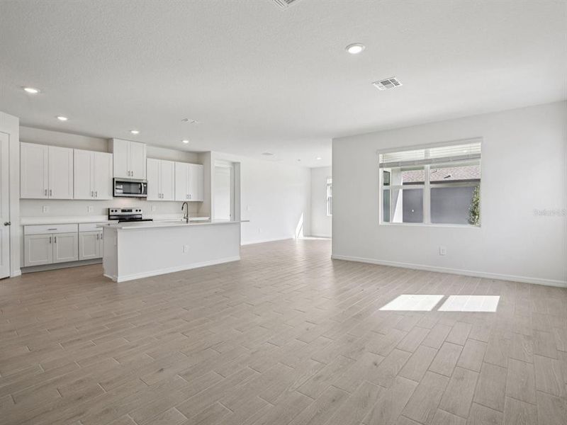 Spacious, unfurnished interior of a new home in Coasterra - Reserve Series, Palmetto (Image 18).