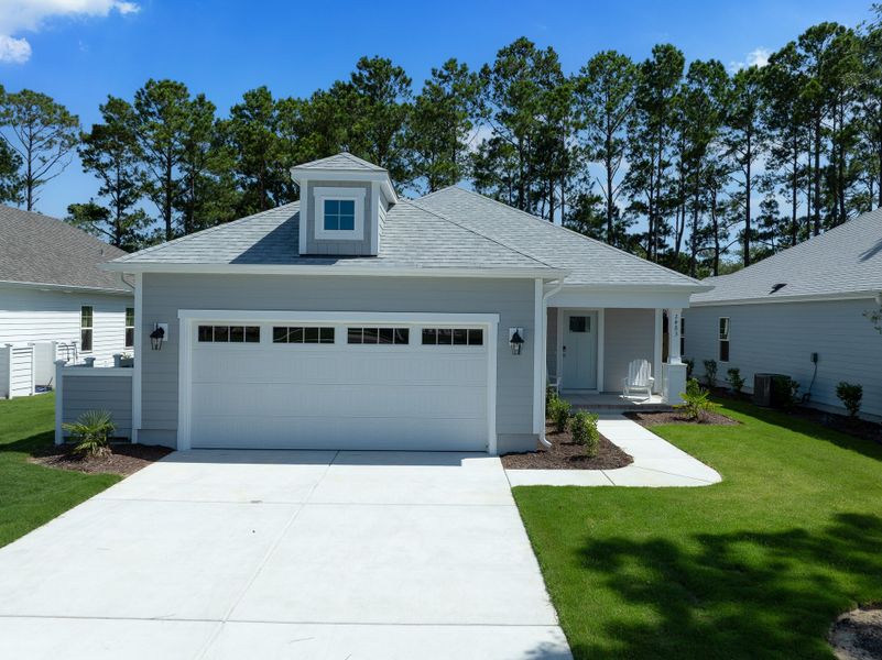 Representative exterior photo of a completed home built from the Shoreline by Bill Clark Homes in Osprey Landing, Southport, NC (Image 27).