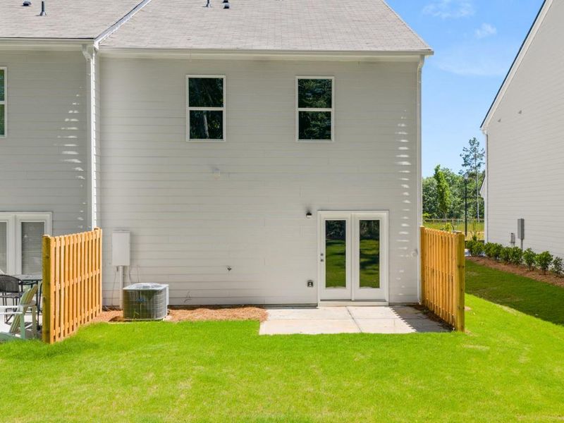 Exterior details and patio area of a home in Falcon Landing Townhomes, Gainesville (Image 4).