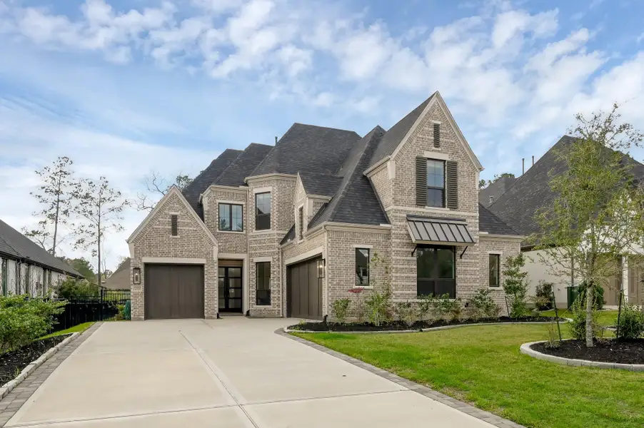 Nestled on a quiet street in the subdivision of Noble Greens, this 2024 Huntington Home offers refined living in the heart of Woodforest.