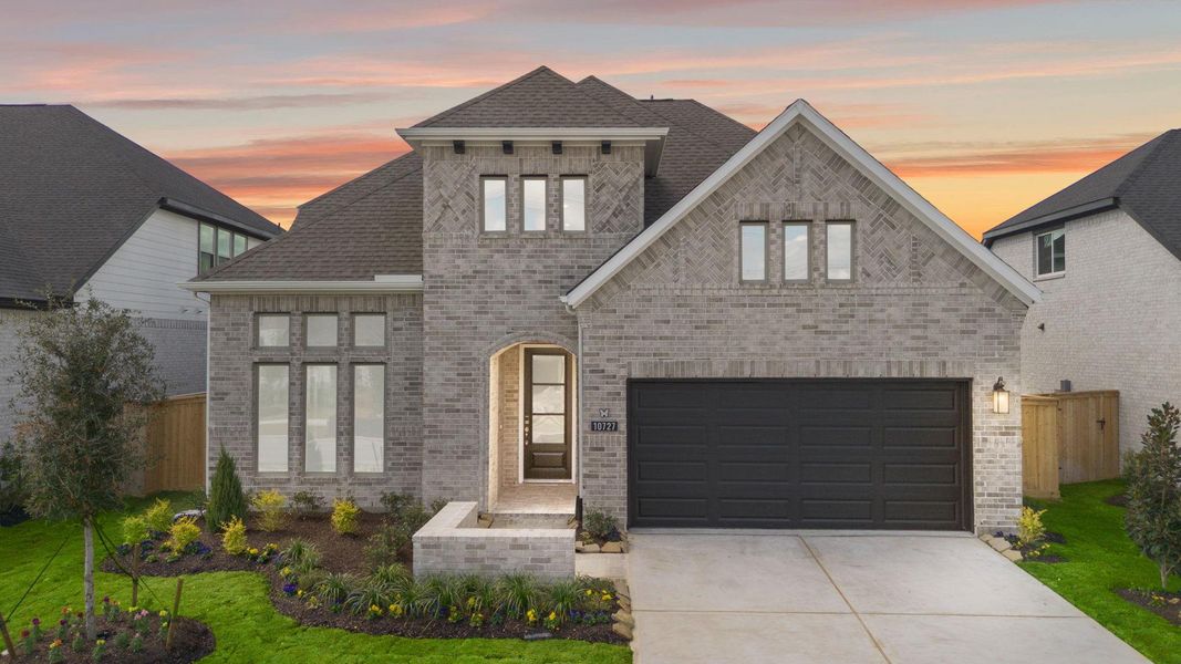 Front exterior of a new home in Bridgeland 55', Cypress, TX, highlighting curb appeal (Image 2).
