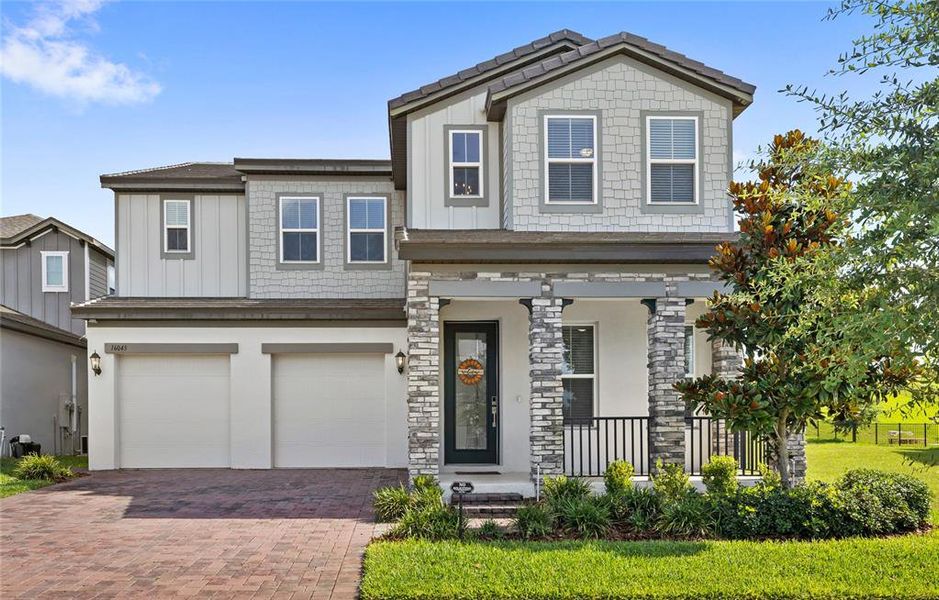 Front exterior of a new home in , Winter Garden, FL, highlighting curb appeal (Image 34).