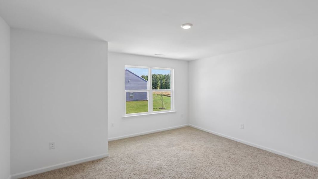 Spacious, unfurnished interior of a new home in The Townes at Belle Grove, Wendell (Image 11).