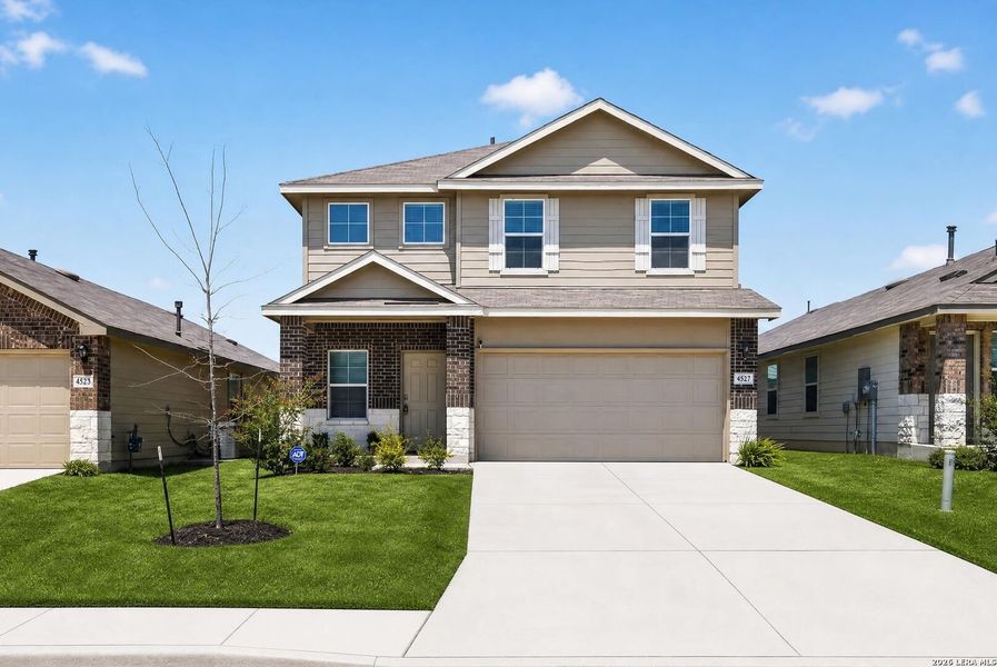 Front exterior of a new home in Avenida, Converse, TX, highlighting curb appeal (Image 22). Front exterior of a new home in Avenida, Converse, TX, highlighting curb appeal (Image 22).