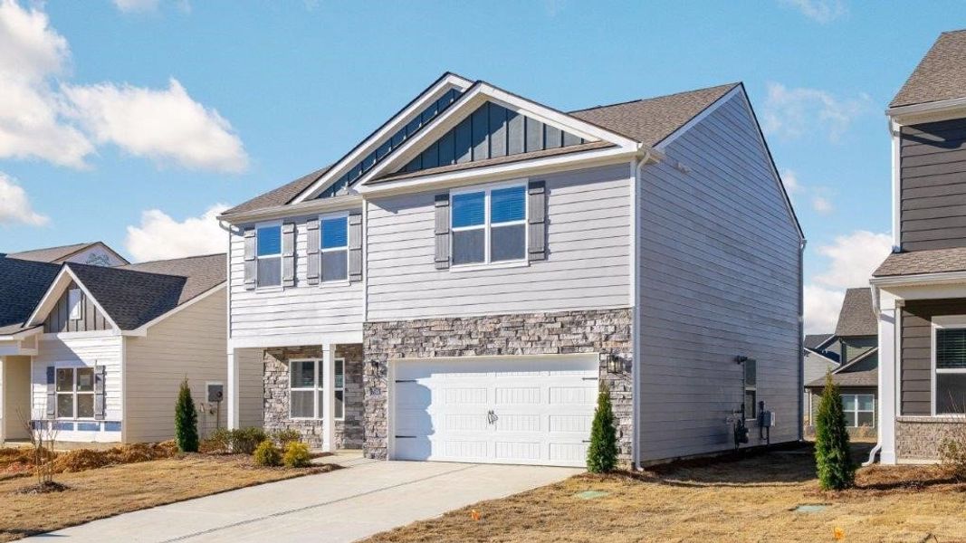 Front exterior of a new home in The Cove at Thrasher Landing, Hixson, TN, highlighting curb appeal (Image 14).