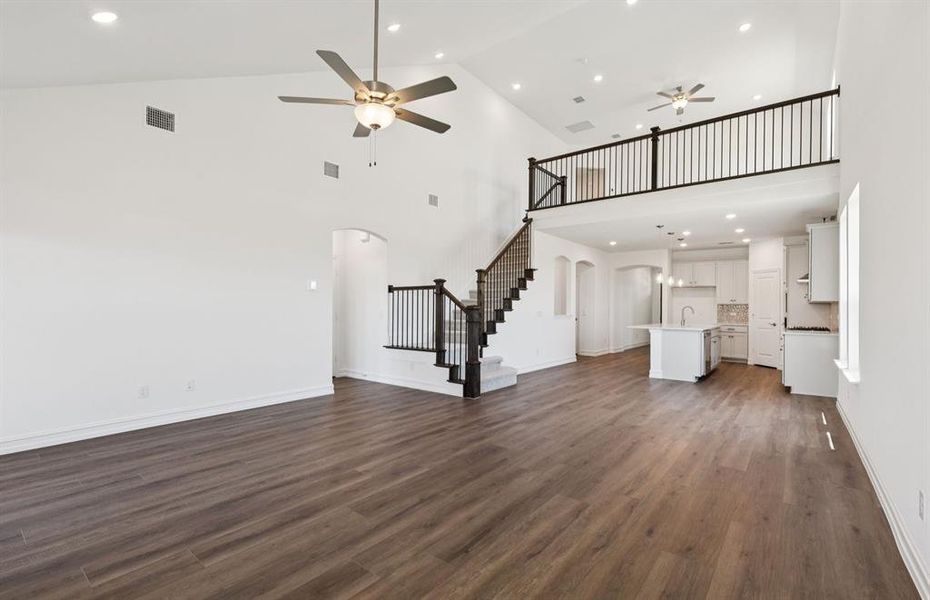 Open concept gathering room creating a spacious and inviting atmosphere *Real home pictured Open concept gathering room creating a spacious and inviting atmosphere *Real home pictured