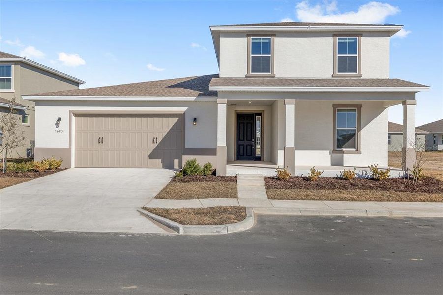 Front exterior of a new home in Calesa Township, Ocala, FL, highlighting curb appeal (Image 23).