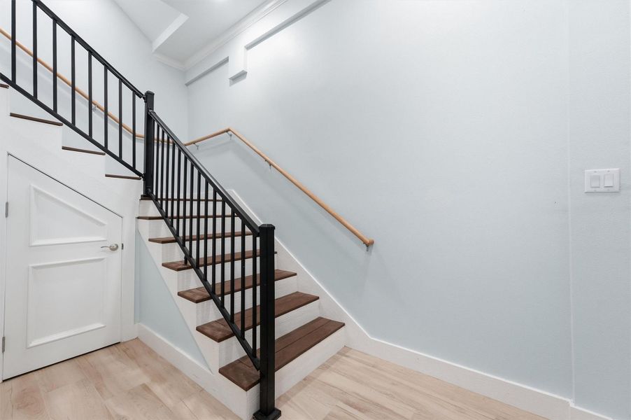 Entryway staircase, with additional storage underneath. There is an elevator for added convinience.