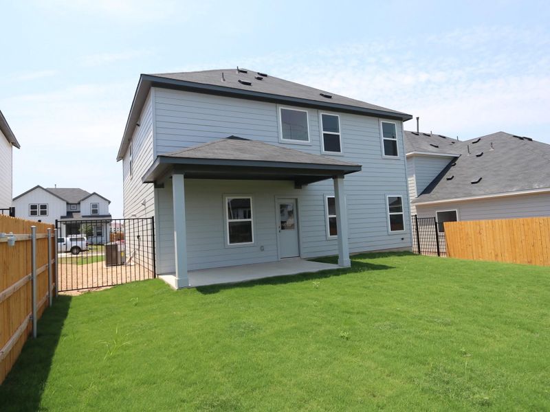 Front exterior of a new home in Cascades at Onion Creek, Austin, TX, highlighting curb appeal (Image 13). Front exterior of a new home in Cascades at Onion Creek, Austin, TX, highlighting curb appeal (Image 13).