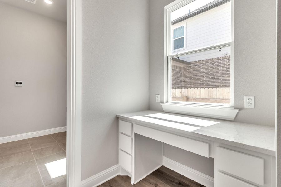 Unfurnished office with baseboards Unfurnished office with baseboards