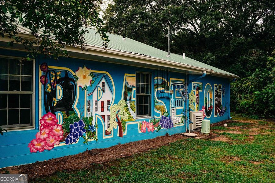 Front exterior of a new home in Rosewood Lake Estates, Hoschton, GA, highlighting curb appeal (Image 40).