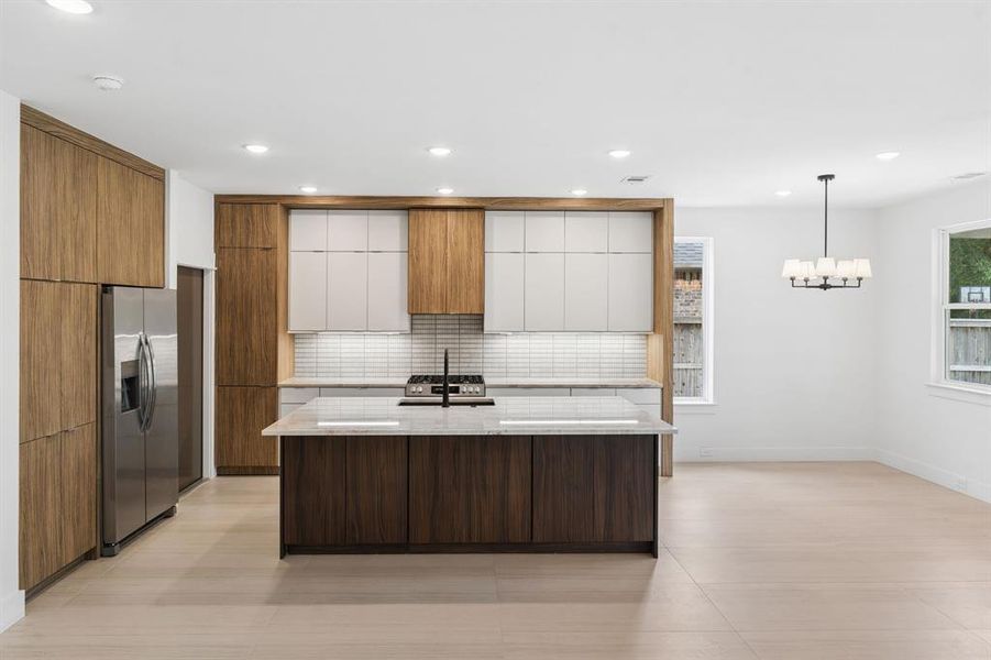 Kitchen with modern design and large island.