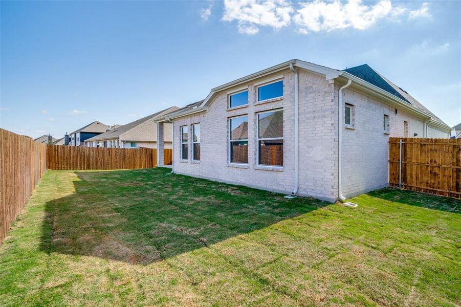 Exterior details and patio area of a home in West Crossing, Anna (Image 18). Exterior details and patio area of a home in West Crossing, Anna (Image 18).