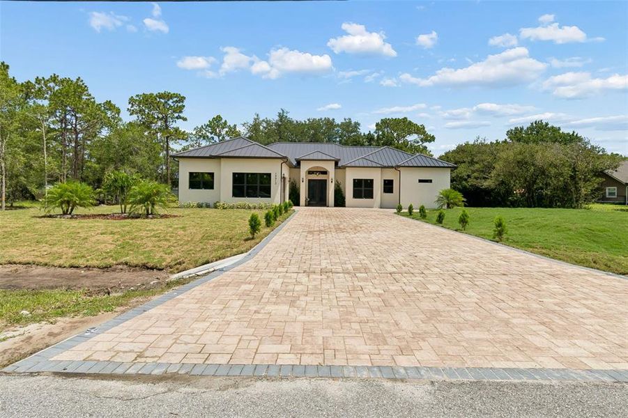 Front exterior of a new home in , Orlando, FL, highlighting curb appeal (Image 1). Front exterior of a new home in , Orlando, FL, highlighting curb appeal (Image 1).