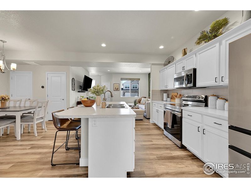 Kitchen with Island and Stainless Steel appliances
