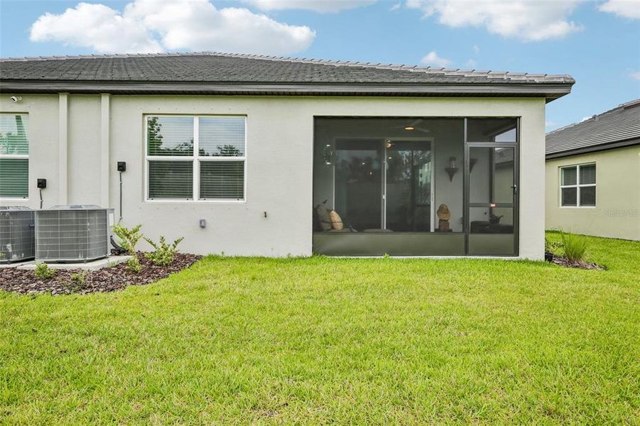 Exterior details and patio area of a home in Prosperity Lakes Active Adult, Parrish (Image 3).